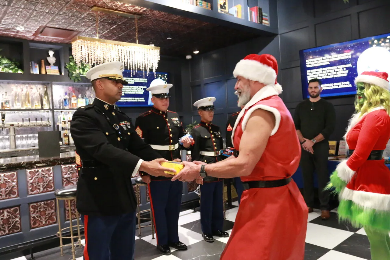 Marines supporting a Toys for Tots collection during a holiday mixer