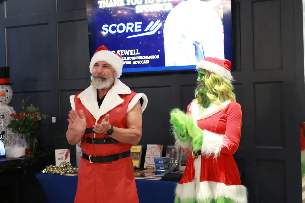 Santa host holding a microphone at a holiday community event