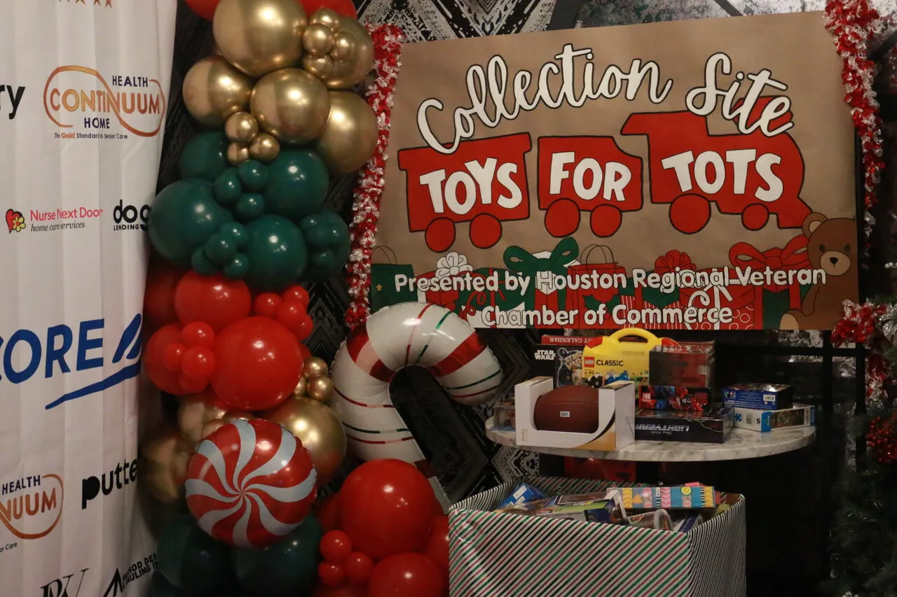 Toys for Tots collection area with donated gifts and holiday decor