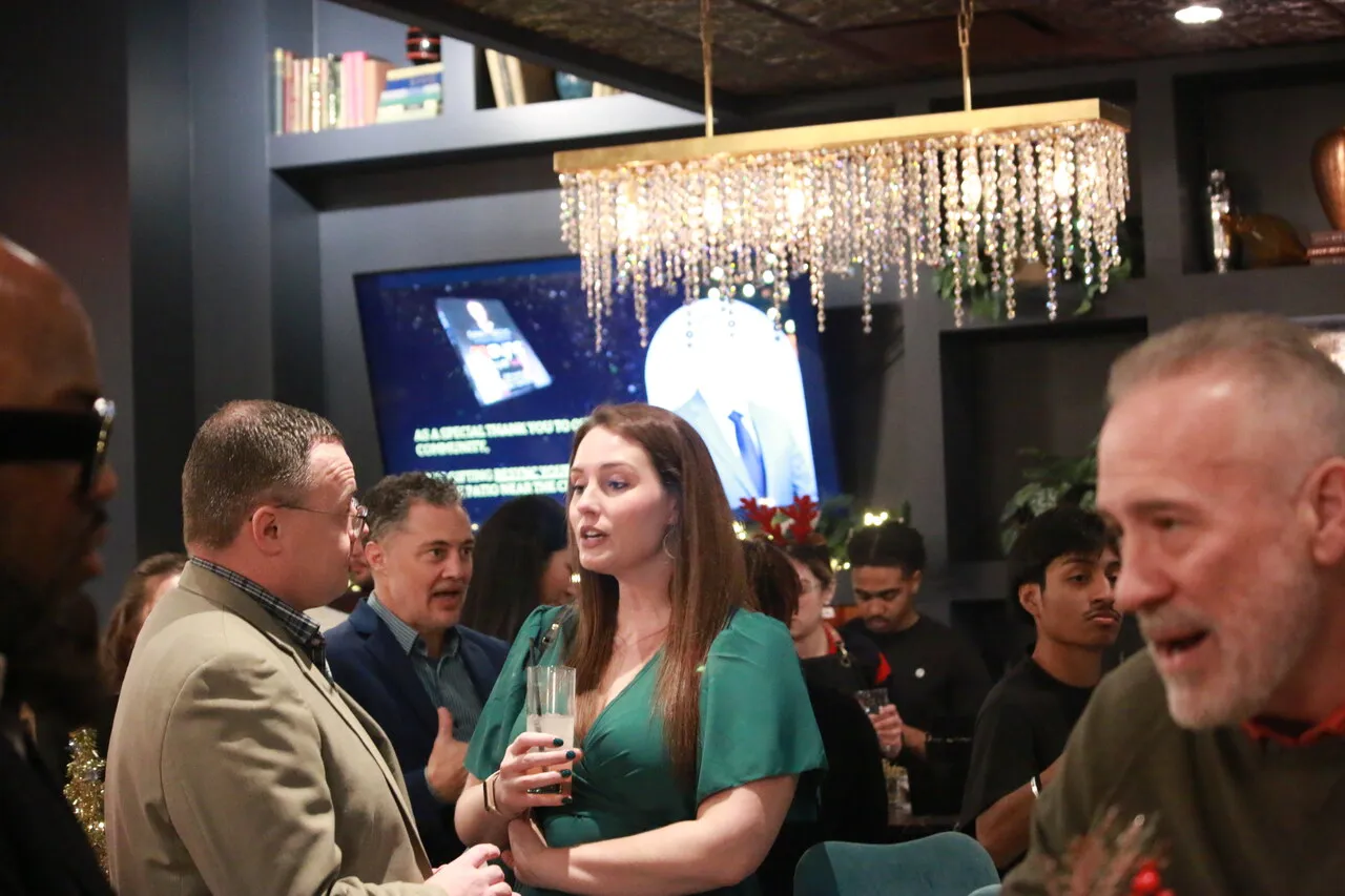 Guests networking in a crowded event space during a business gathering