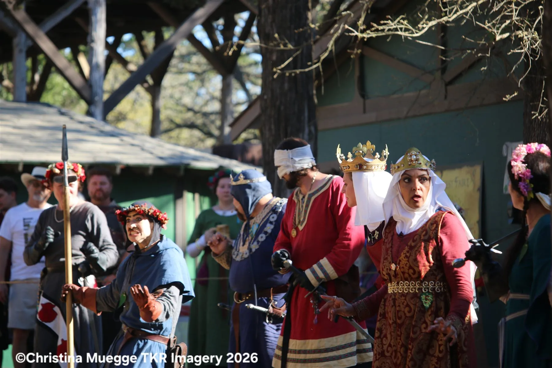 Renaissance festival performer in a blue royal costume